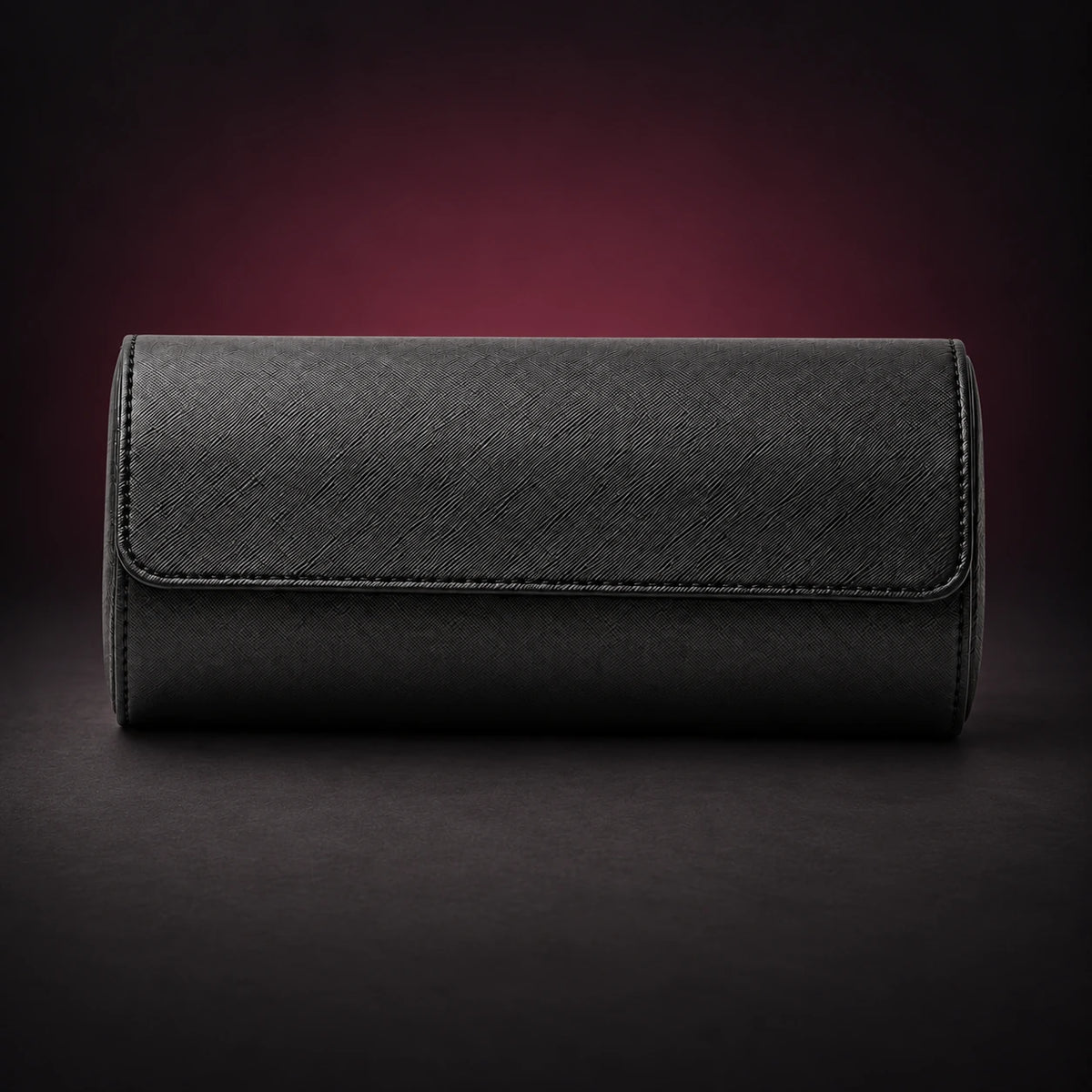 Nomad black PU three-watch travel roll shown closed with its curved wraparound cover.