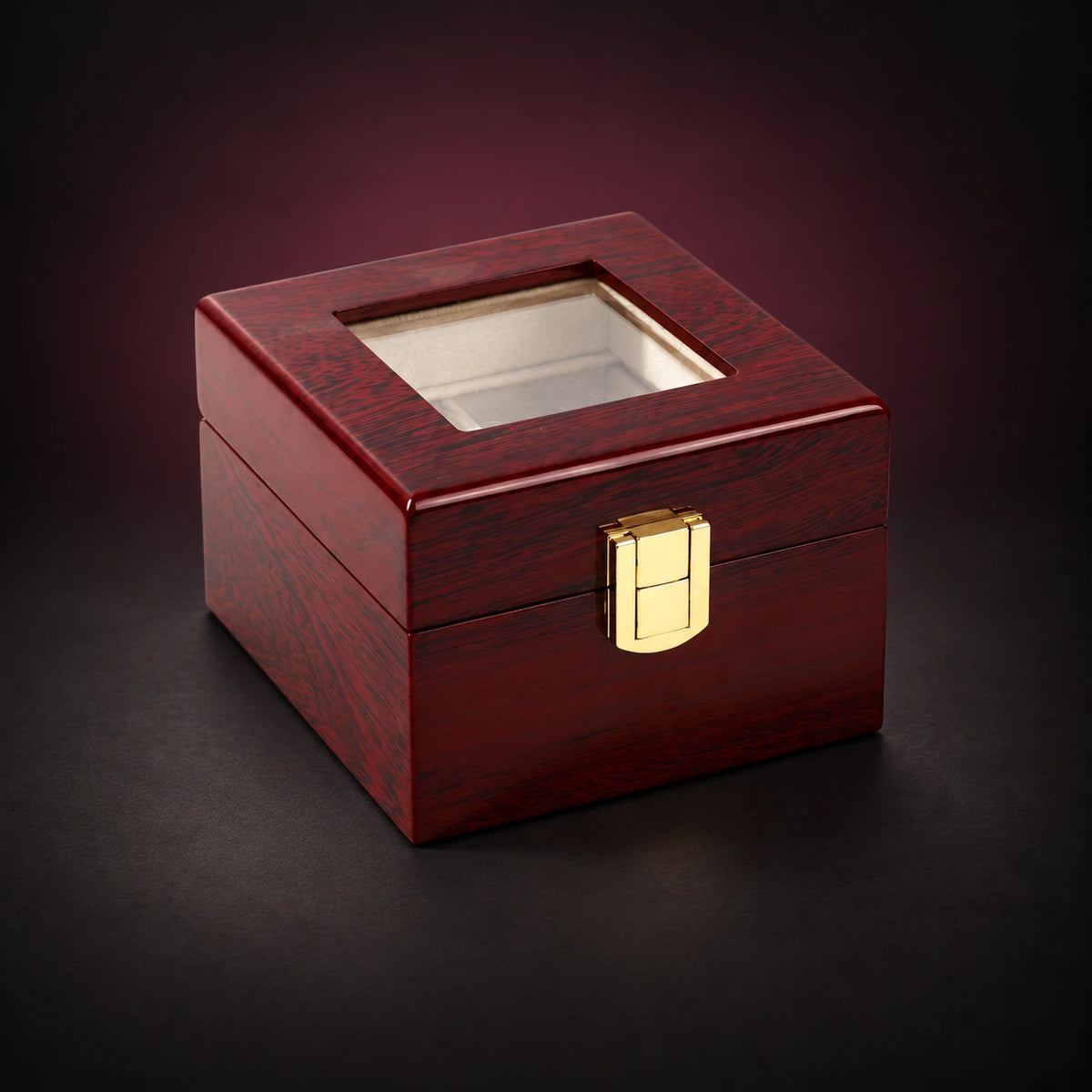 Heritage two-watch storage box with its clear lid closed, red wood-grain finish and gold-tone clasp.