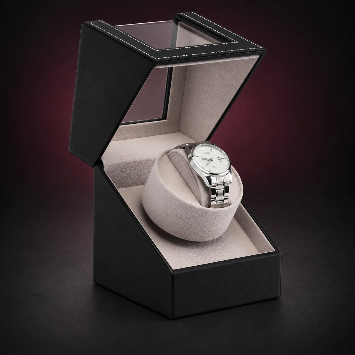 Solo black single watch winder with its hinged lid open, showing the cream interior and a demonstration watch, not included.