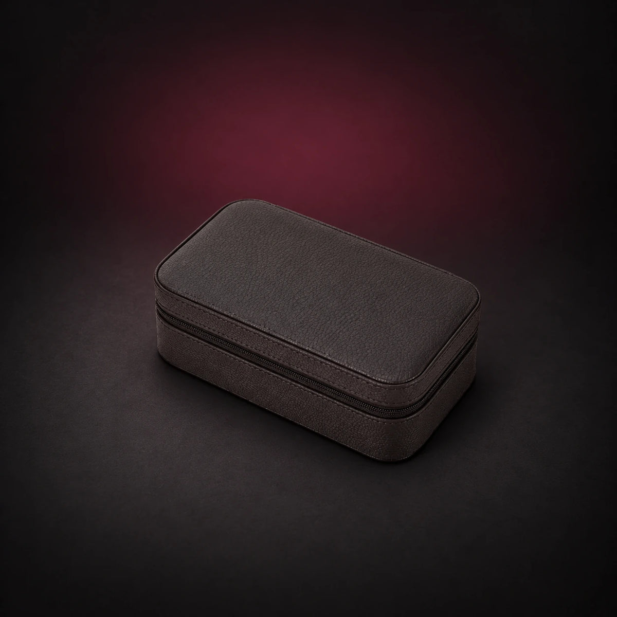 Voyage coffee pebbled three-watch travel case shown closed with its zippered edge visible.