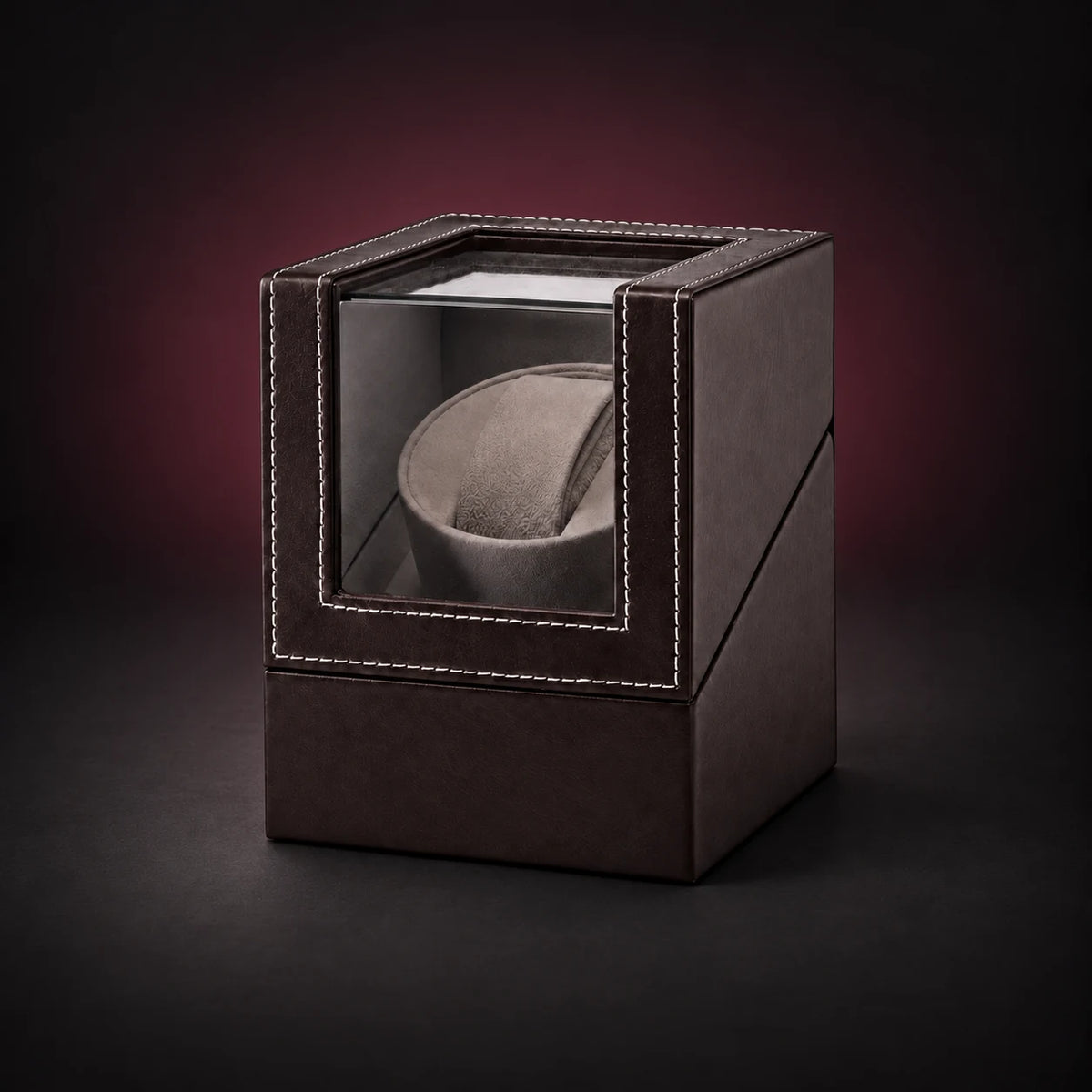 Solo brown single watch winder with a clear hinged lid and one empty watch cushion.